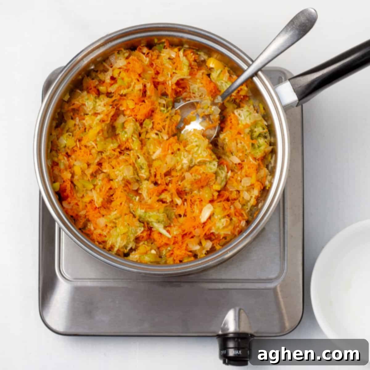 Easy Guilt-Free Turkey Meatloaf 4 Sauté the chopped onion, garlic, bell pepper, grated carrot, and zucchini