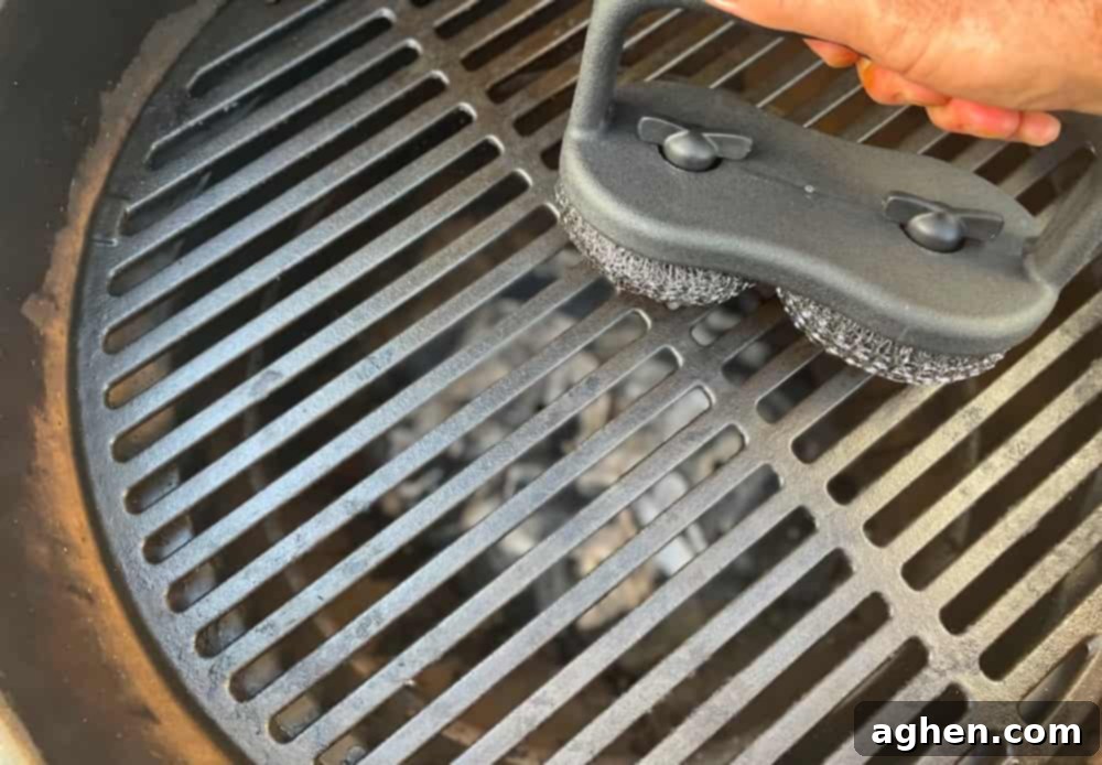 Big Green Egg Cleaning: Achieve Peak Performance Every Time 1 scrubbing big green egg grill surface with brush