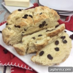 You will love this quick and easy Irish Soda Bread with Raisins recipe made with flour, baking soda, salt, sugar, egg, butter, buttermilk, and raisins for St. Patrick's Day or any time of year!