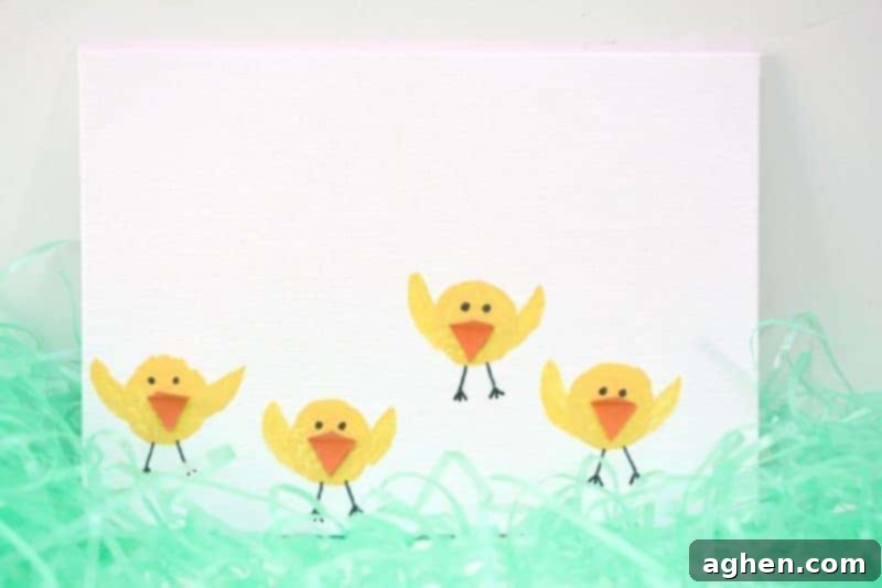 Finished Easter chicks craft, made by stamping wine corks, ready for display.