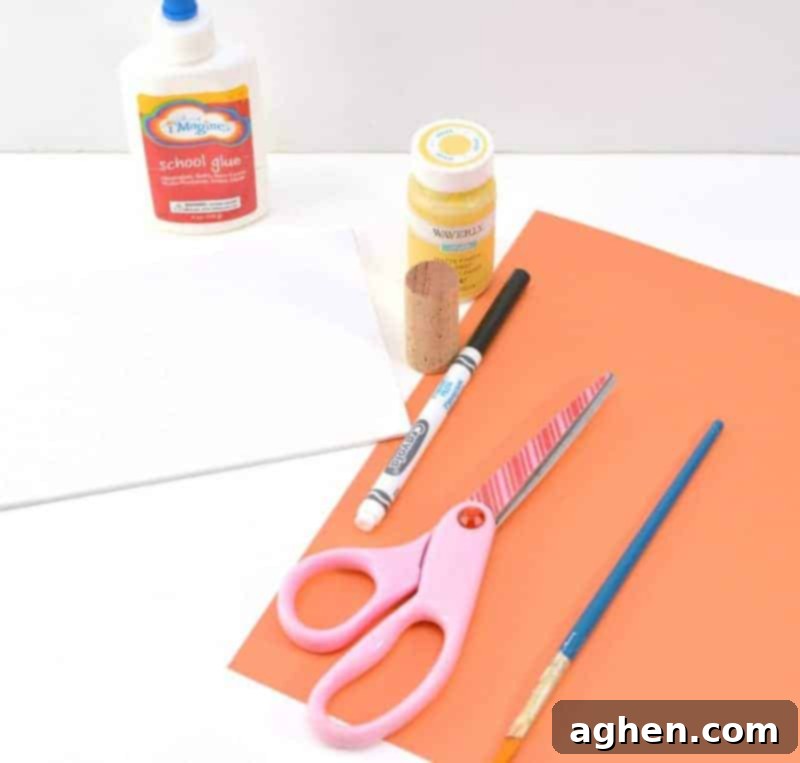 Essential supplies for making the Easter chicks craft, including yellow paint, wine cork, paper, markers, and orange cardstock.