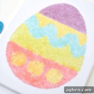 Completed colorful salt glitter Easter egg canvas art project.