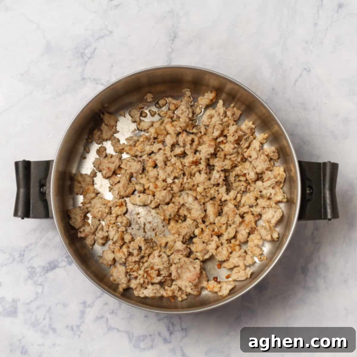 Irresistible Zero Point Turkey Chili 4 Ground turkey browning in a hot pan with olive oil and spices.