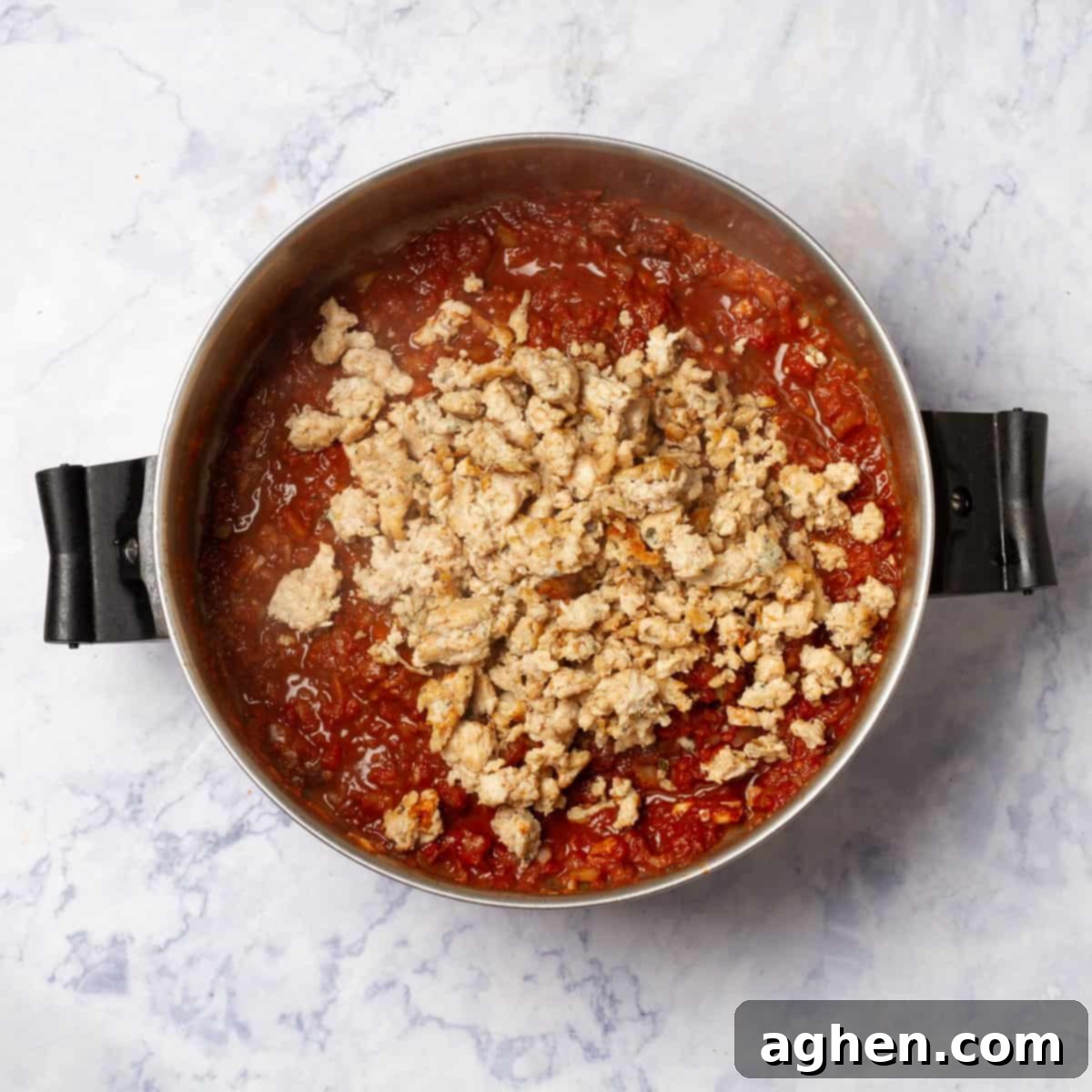 Irresistible Zero Point Turkey Chili 5 Diced tomatoes, chopped onions, and liquid added to the browned ground turkey in a hot pot.