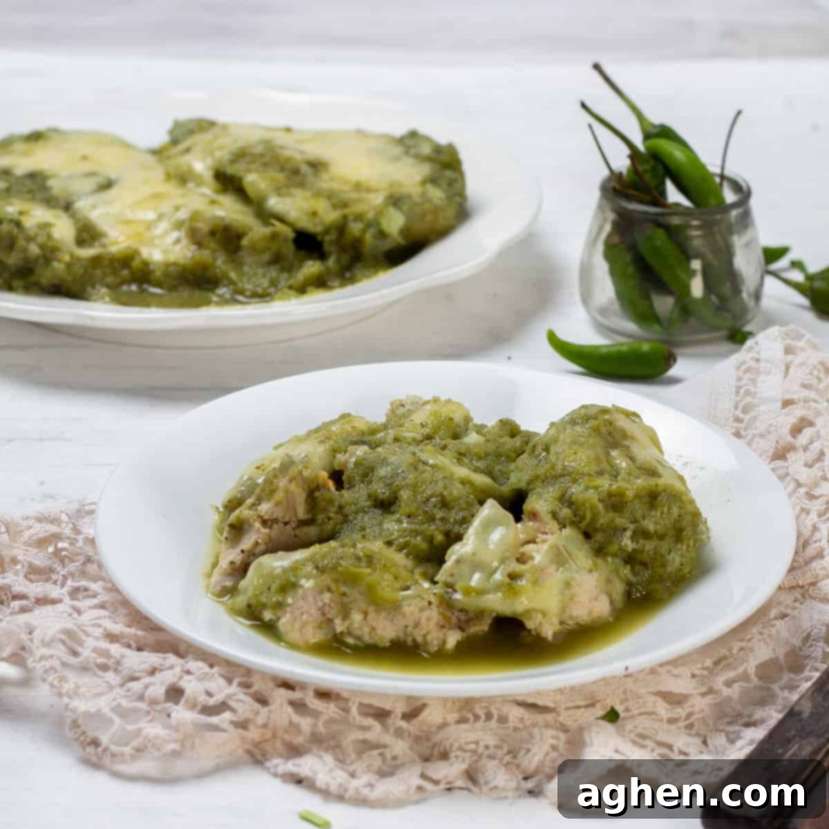 Simple yet satisfying salsa verde chicken ready to be served from a baking dish.