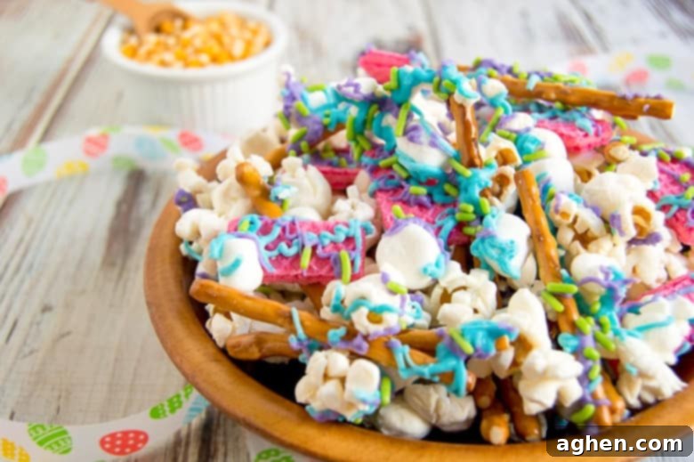 Bunny Bait snack mix, a colorful Easter treat with popcorn, pretzels, and chocolate, arranged on a serving plate.