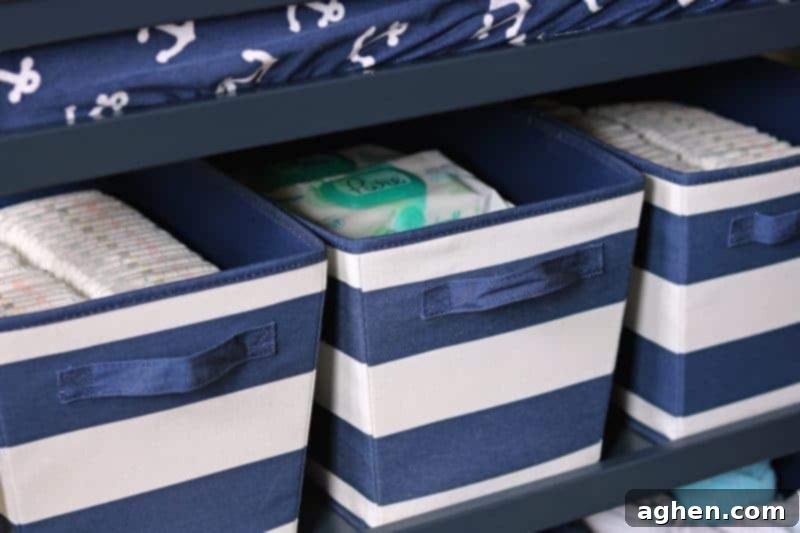 Pampers Pure diapers neatly organized in storage bins within a changing table