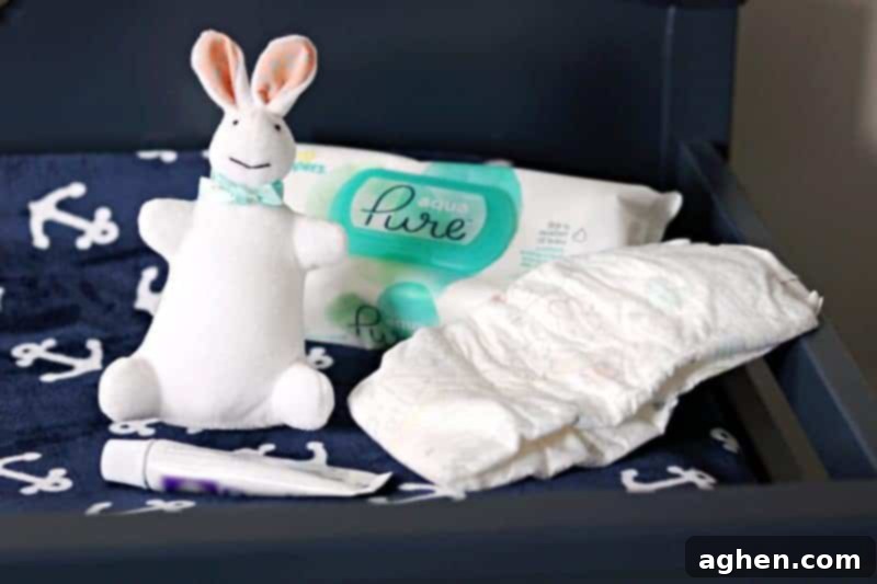 A fully stocked baby changing station with diapers, wipes, and other essentials