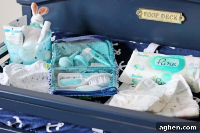 Hands-free diaper pail positioned next to a changing table for convenient disposal