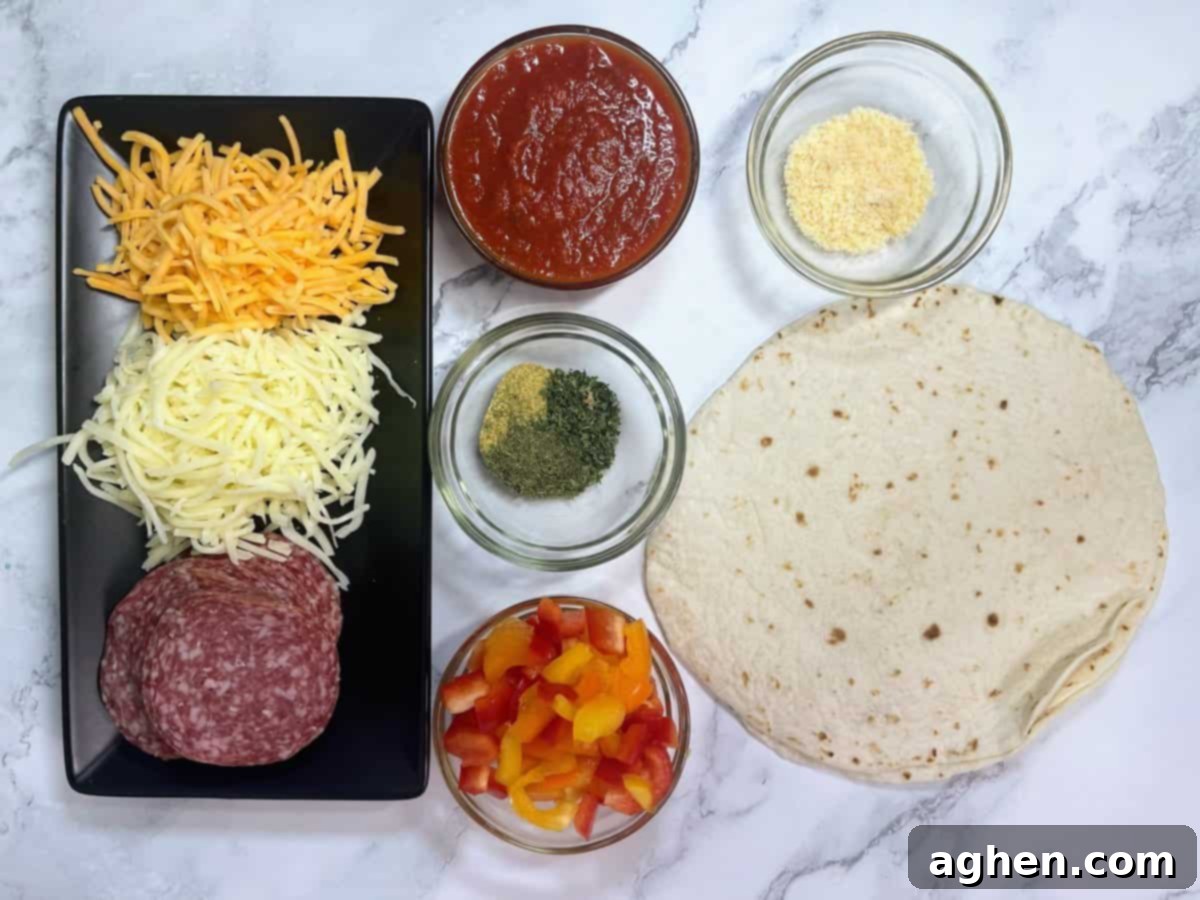 Snack Goals: Baked Pizza Burritos 3 All ingredients for pizza burritos neatly arranged on a kitchen counter: tortillas, pepperoni, cheese, sauce, and spices.