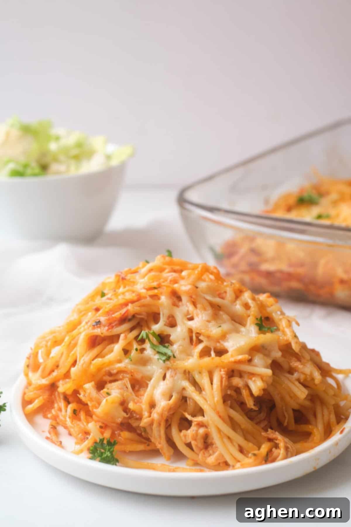 14 Weight Watchers Pasta Recipes You Must Try This Fall 14 Chicken parmesan spaghetti bake on white plate