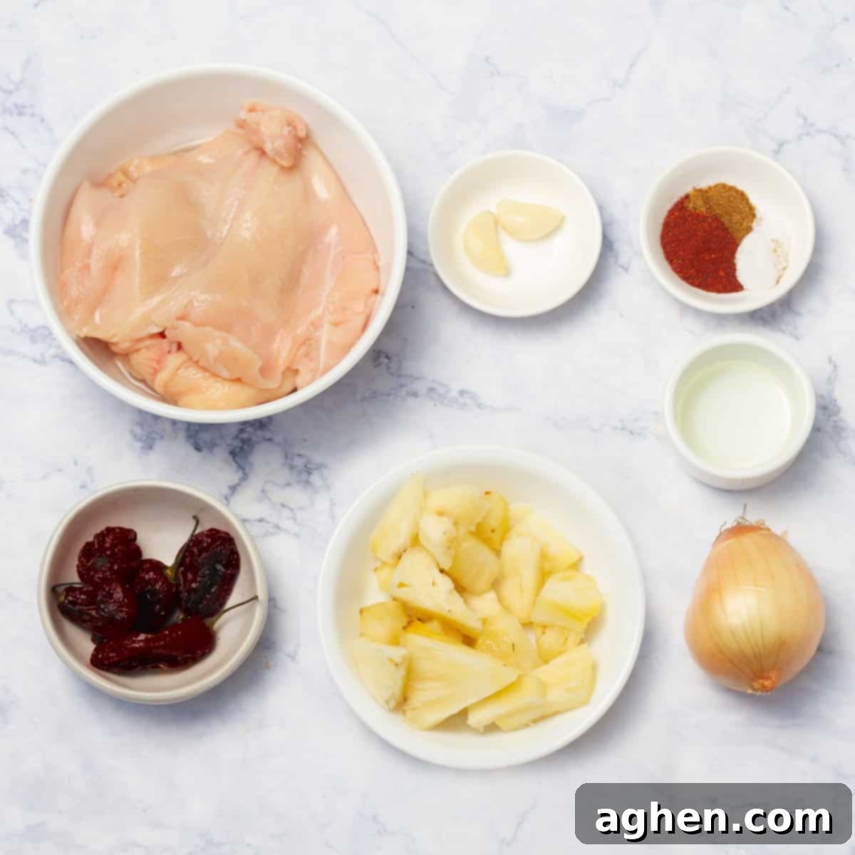 Collection of fresh and dried ingredients for the al pastor marinade