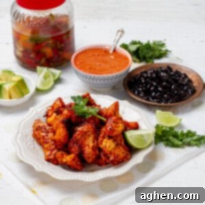 Chicken al Pastor served with cilantro topping and lemon slice
