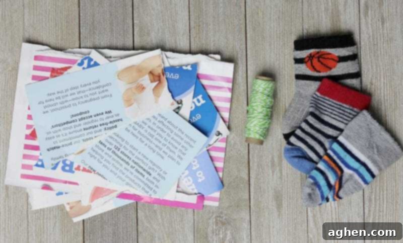 Arrangement of supplies for making DIY cat toys: baby socks, scrap paper, string, and scissors.
