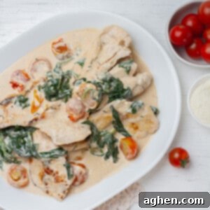 Creamy Weight Watchers Tuscan Chicken with spinach and cherry tomatoes.
