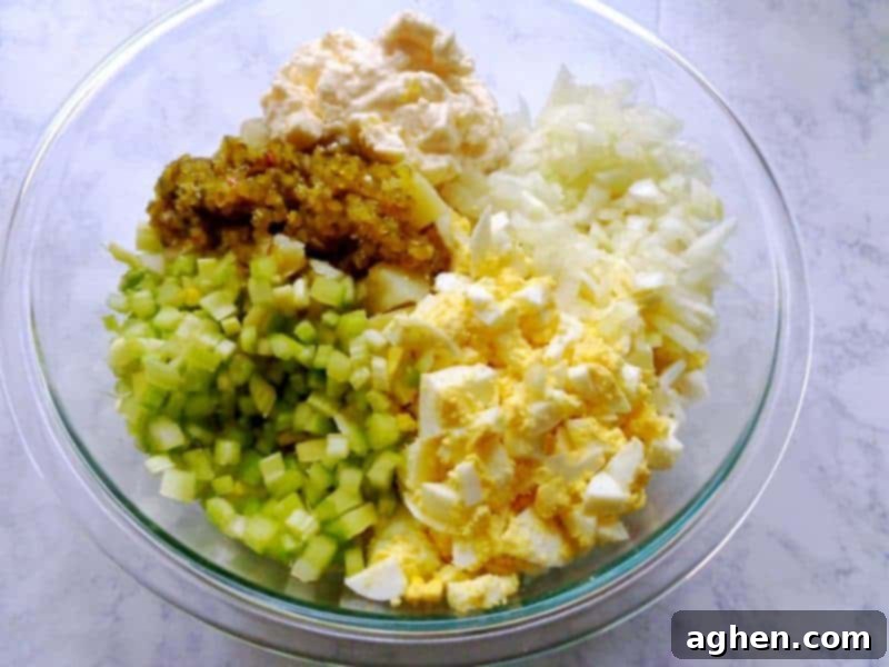 Mixing ingredients for creamy old fashioned potato salad