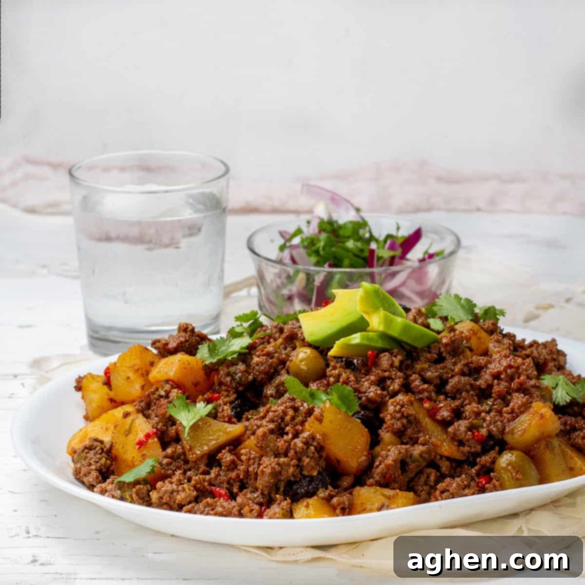 Cuban Picadillo served with salad and dressing of Avocados slices