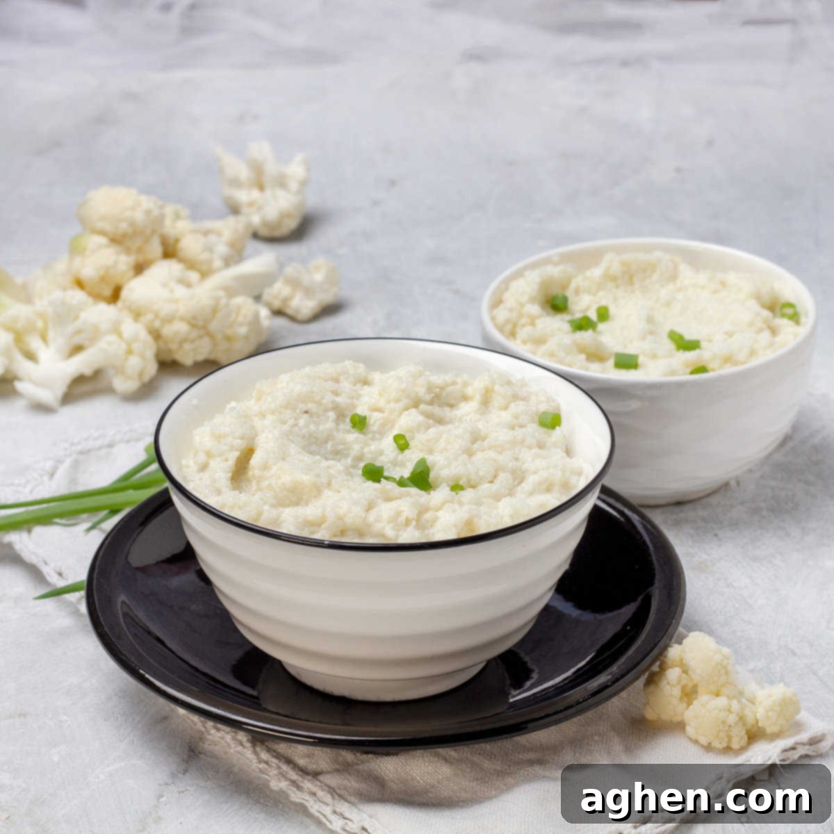 The Zero Point Mashed Cauliflower I Make On Repeat 2 Creamy Mashed Cauliflower served elegantly in a bowl, garnished for a fresh look.
