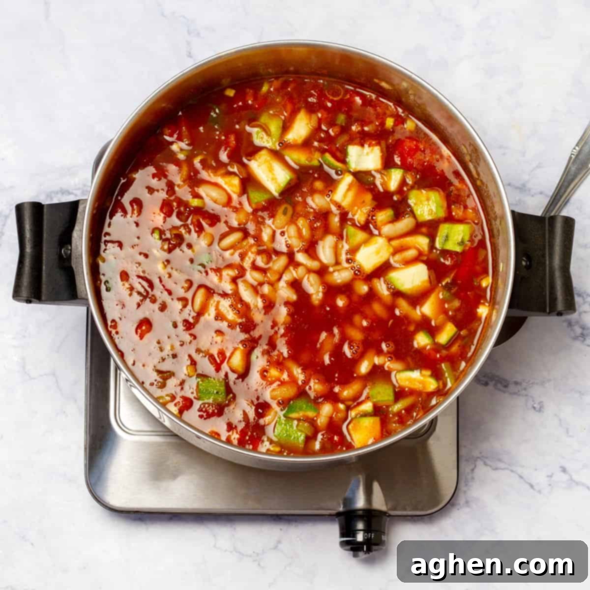 Zero Point Minestrone: Your Cozy, Guilt-Free Chilly Day Essential 5 Minestrone Soup simmering gently on a stovetop.