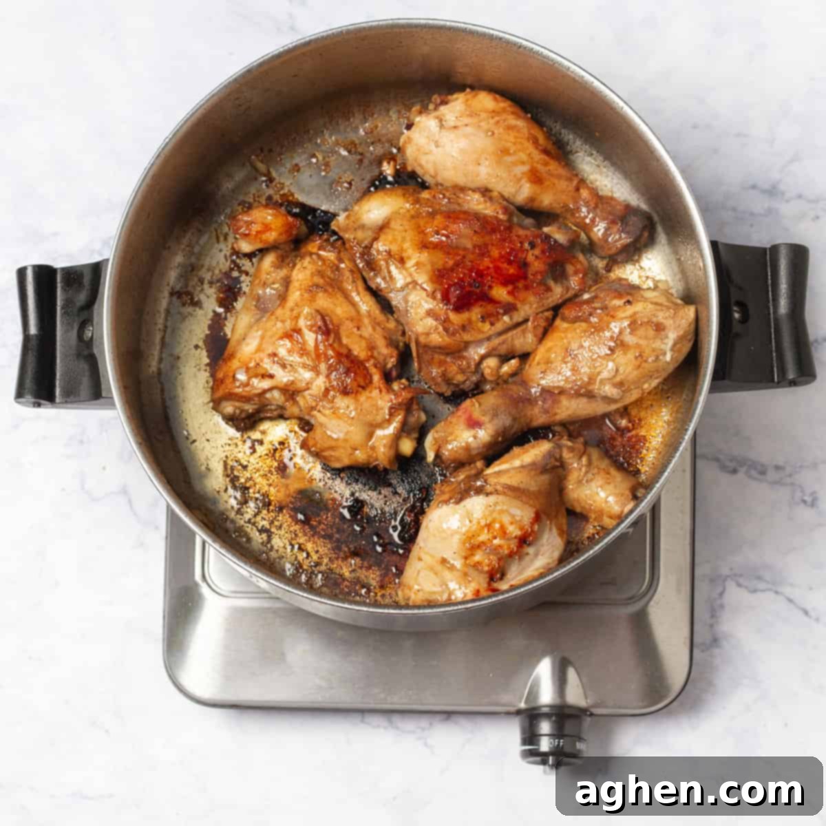 Experience the Authentic Filipino Chicken Adobo 6 Filipino Chicken Adobo simmering over medium flame
