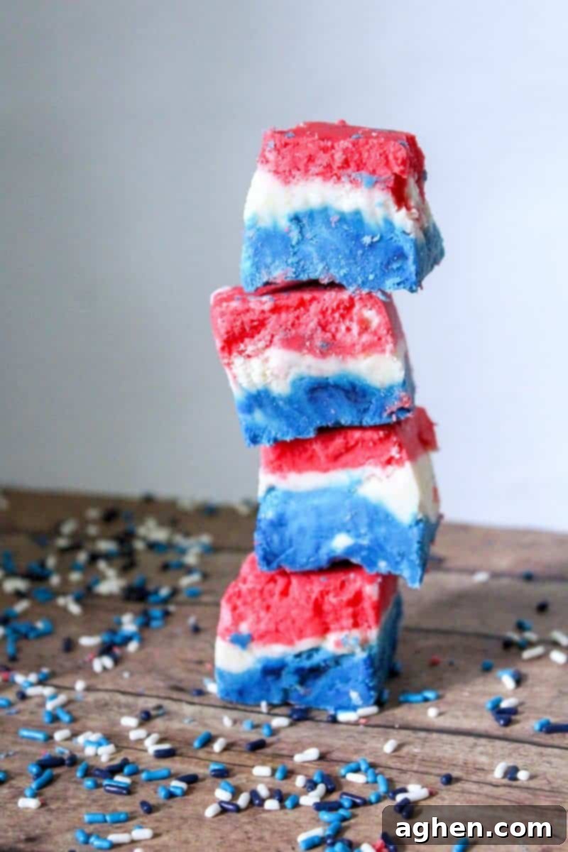 Close-up of a perfectly layered Red, White, and Blue Fudge block, ready for slicing. This marshmallow creme fudge is ideal for 4th of July celebrations.