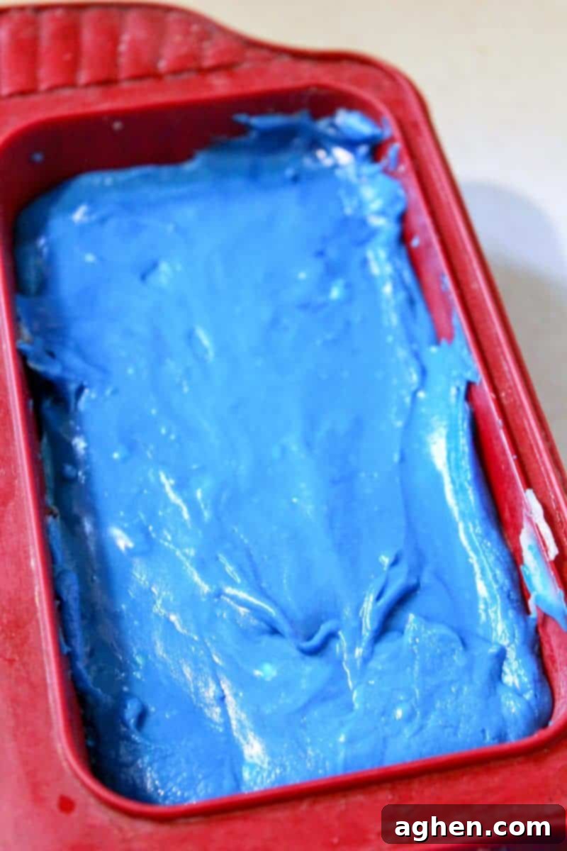Step 4: A second image showing the red and white fudge layers already in the pan, with the blue layer about to be added to complete the patriotic look.