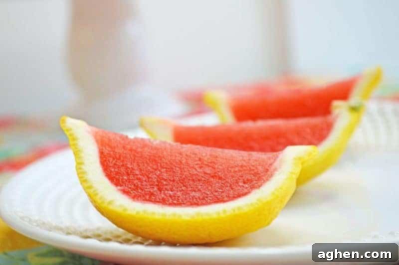 Strawberry lemonade jello shots made with vodka and served in lemon wedges. Don't be fooled -- these lemon wedge jello shots are actually very easy to make!