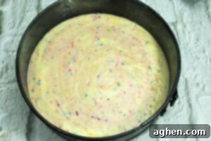 Baking the funfetti cake base for the unicorn cheesecake in a springform pan.