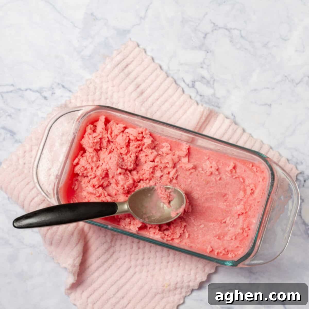 Scraped Strawberry Yogurt Ice Cream Freezing in an Ice Cream Maker