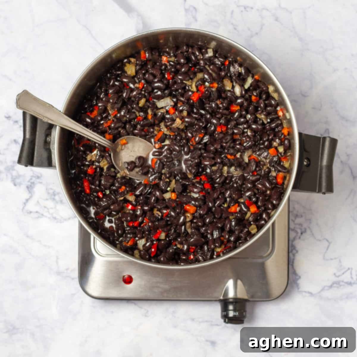 Black Bean Soup ingredients cooking in a pan on medium flame