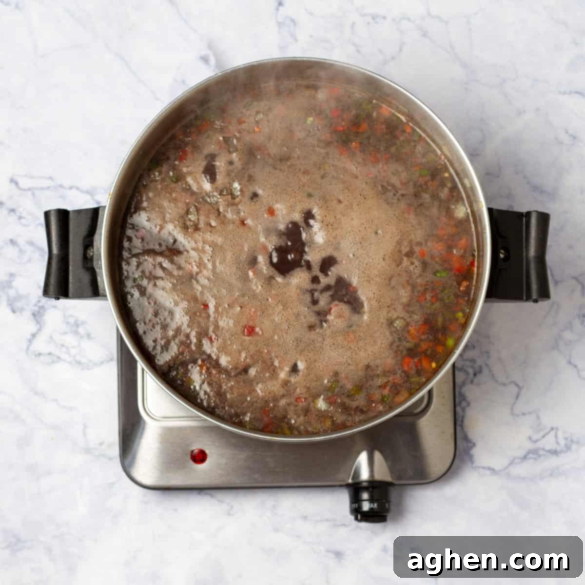 Black Bean Soup cooking in a pan on medium flame