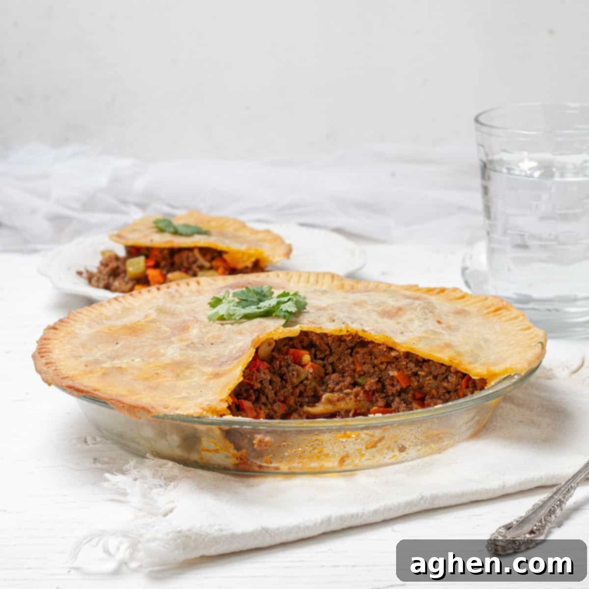 Warm Up Cold Nights with a Hearty Beef Pie 2 Hearty beef pie with a golden, slightly crunchy crust and a visible savory filling. Perfect for a cold night.