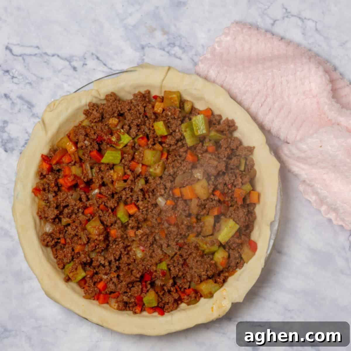 Warm Up Cold Nights with a Hearty Beef Pie 8 The hearty beef and vegetable filling evenly spread within the bottom pie crust.