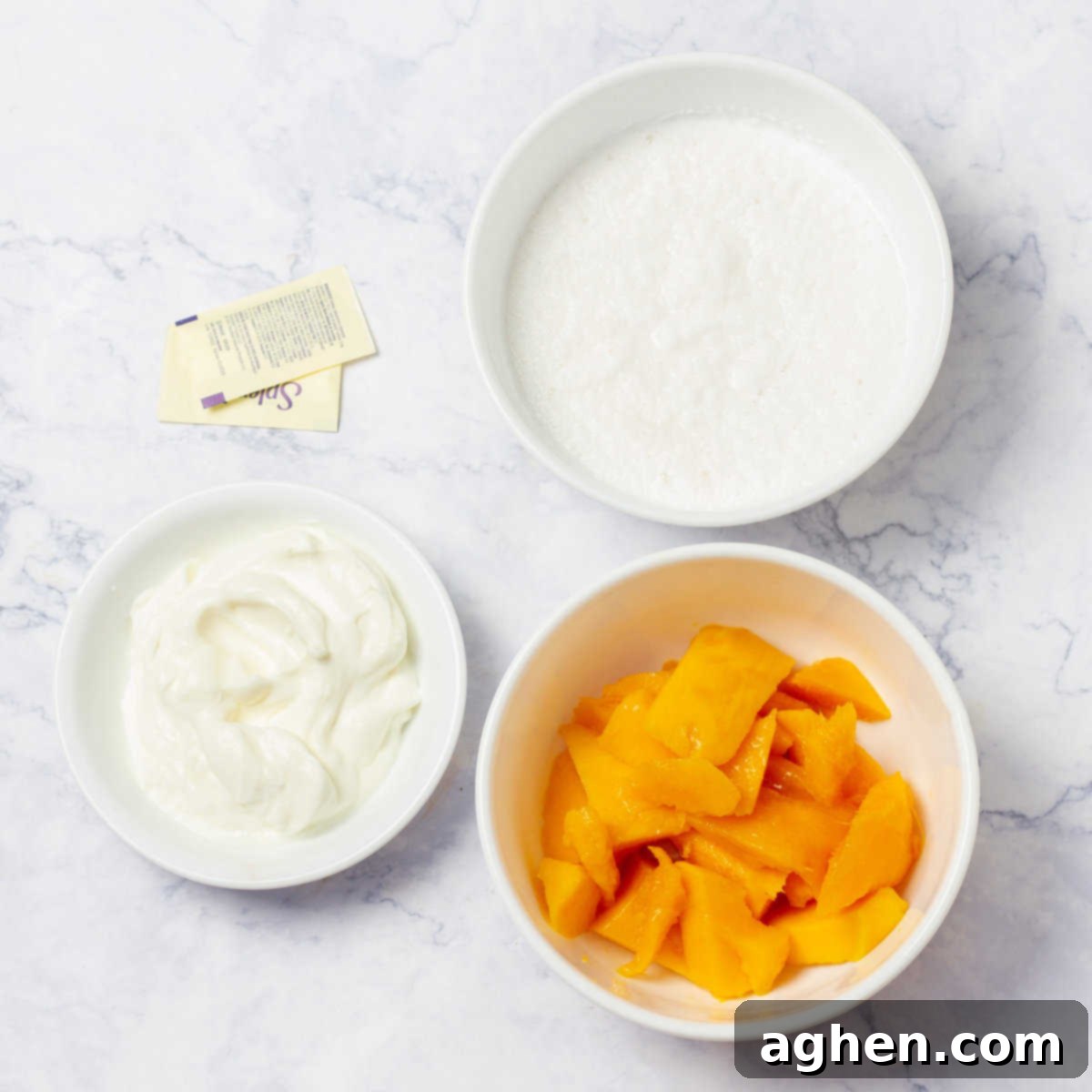 Tropical Mango Coconut Delight 3 Creamy Mango and Coconut Ice Cream Ingredients including mango pulp, Greek yogurt, coconut milk, and Stevia.
