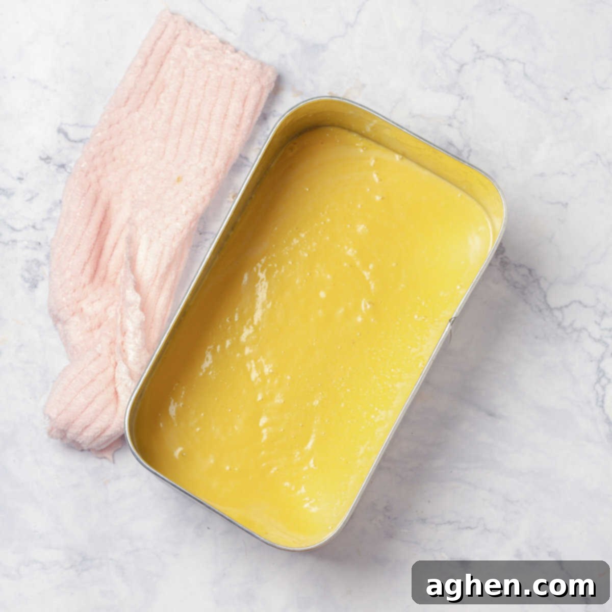 Tropical Mango Coconut Delight 5 Creamy Mango and Coconut Ice Cream mix poured into a metal container for initial freezing.