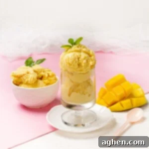 Tropical Mango Coconut Delight 9 Creamy Mango and Coconut Ice Cream served in a bowl and glass with mango
