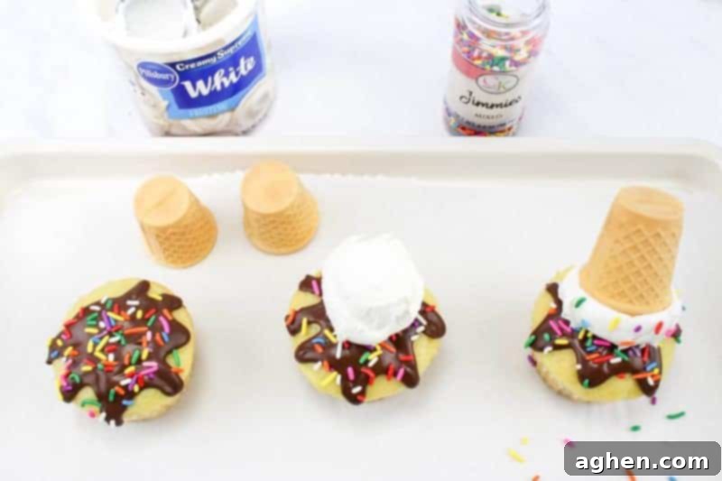 Process shot: Cupcakes with chocolate drips are being decorated with colorful rainbow sprinkles.