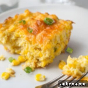 My Weight Watchers Jiffy Corn Casserole Recipe 6 A slice of golden brown Jiffy corn casserole with a creamy texture.