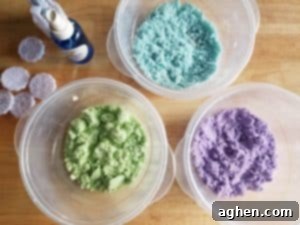 Divide bath bomb mixture into bowls for coloring, adding essential oils and mica powder.