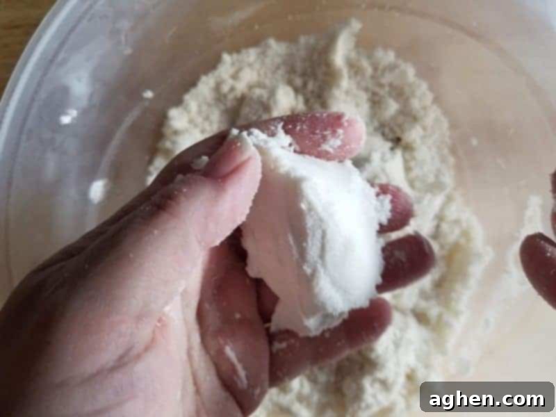 The bath bomb mixture is perfect when you can press it together in your hands and it stays together without crumbling.