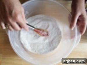 Use a whisk to break down any remaining lumps in the dry mixture.