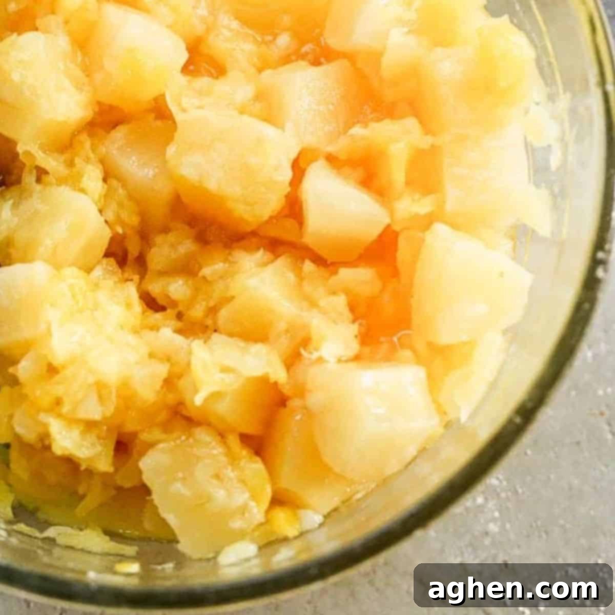 Guilt-Free Sweetness: Weight Watchers Pineapple Casserole 6 preparing filling for pineapple casserole in clear mixing bowl
