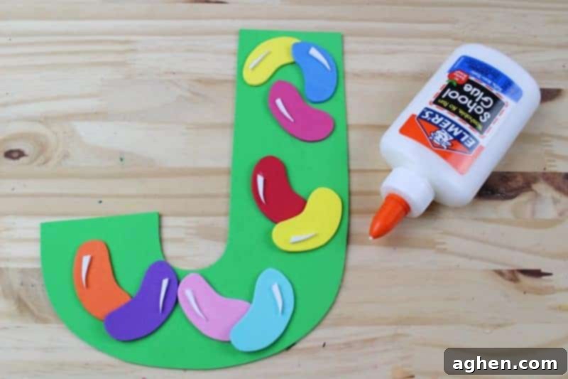 Use white craft foam or marker to add small highlight details to the jelly beans, making them appear shiny.