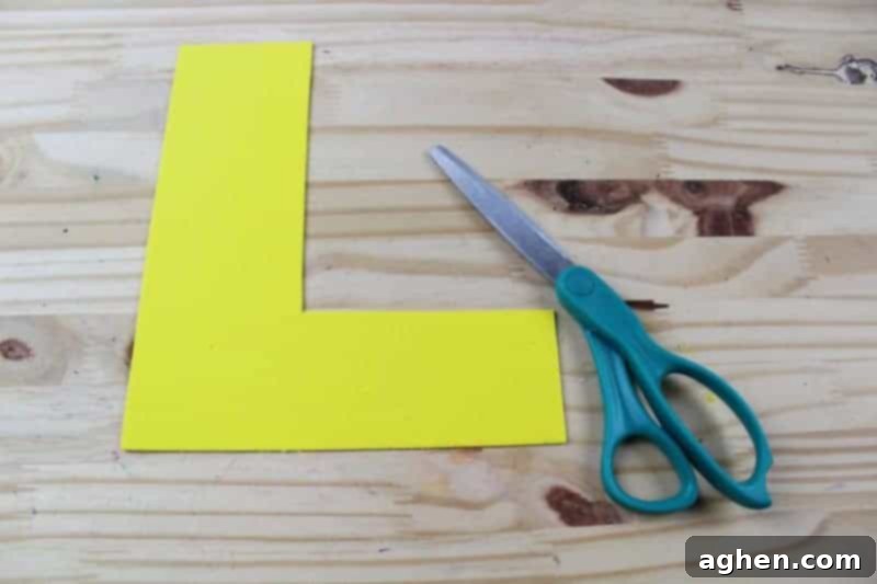Step 3: Cut out the traced letter L shape from the craft foam or colored cardstock, developing scissor skills.