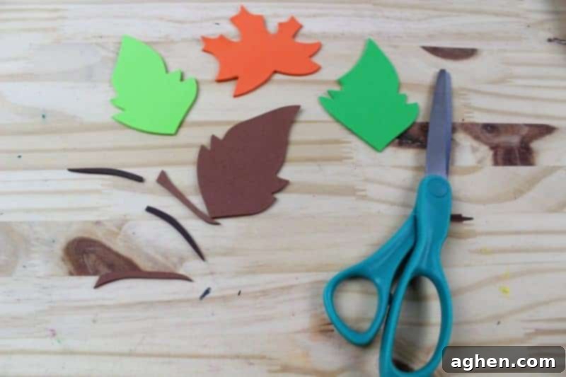 Step 4: Cut out leaf shapes from the printable template and then trace them onto green craft foam to create four leaves.