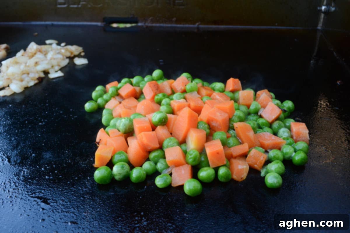 Ultimate Blackstone Chicken Fried Rice 7 frozen peas and carrots blend on blackstone griddle