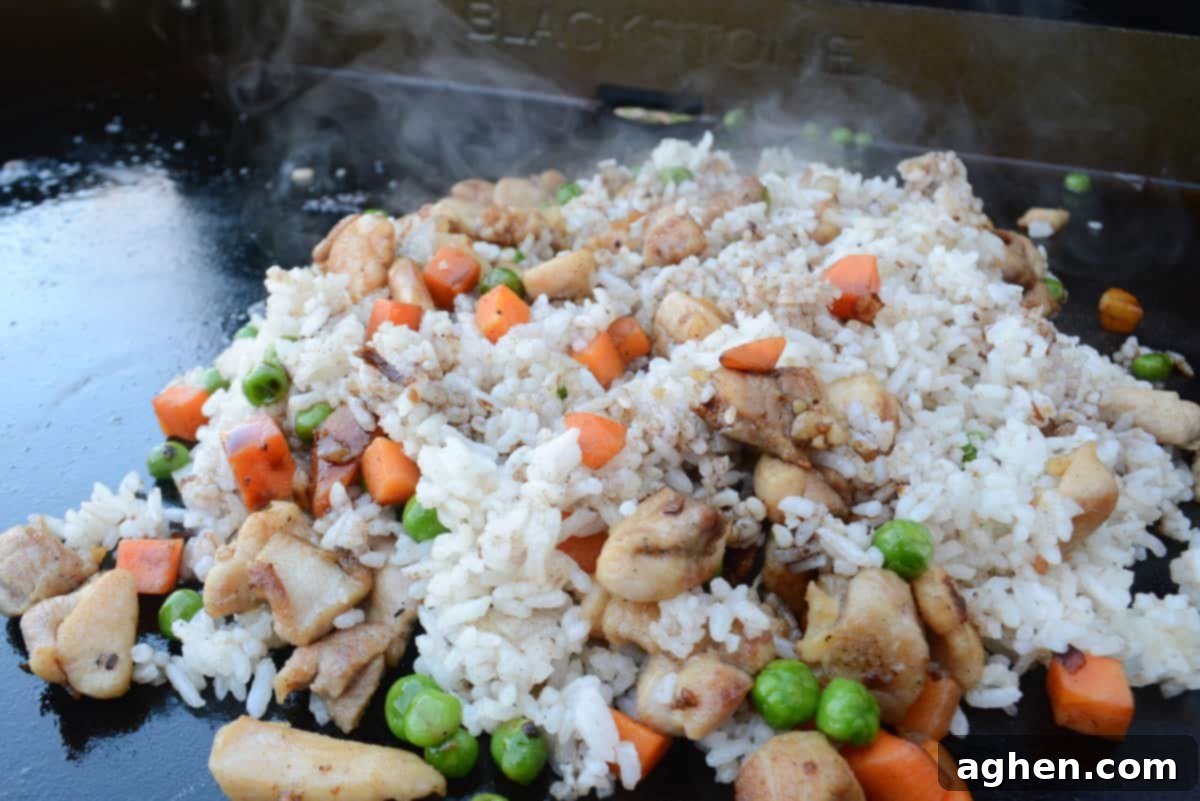 Ultimate Blackstone Chicken Fried Rice 9 chicken fried rice cooking on blackstone