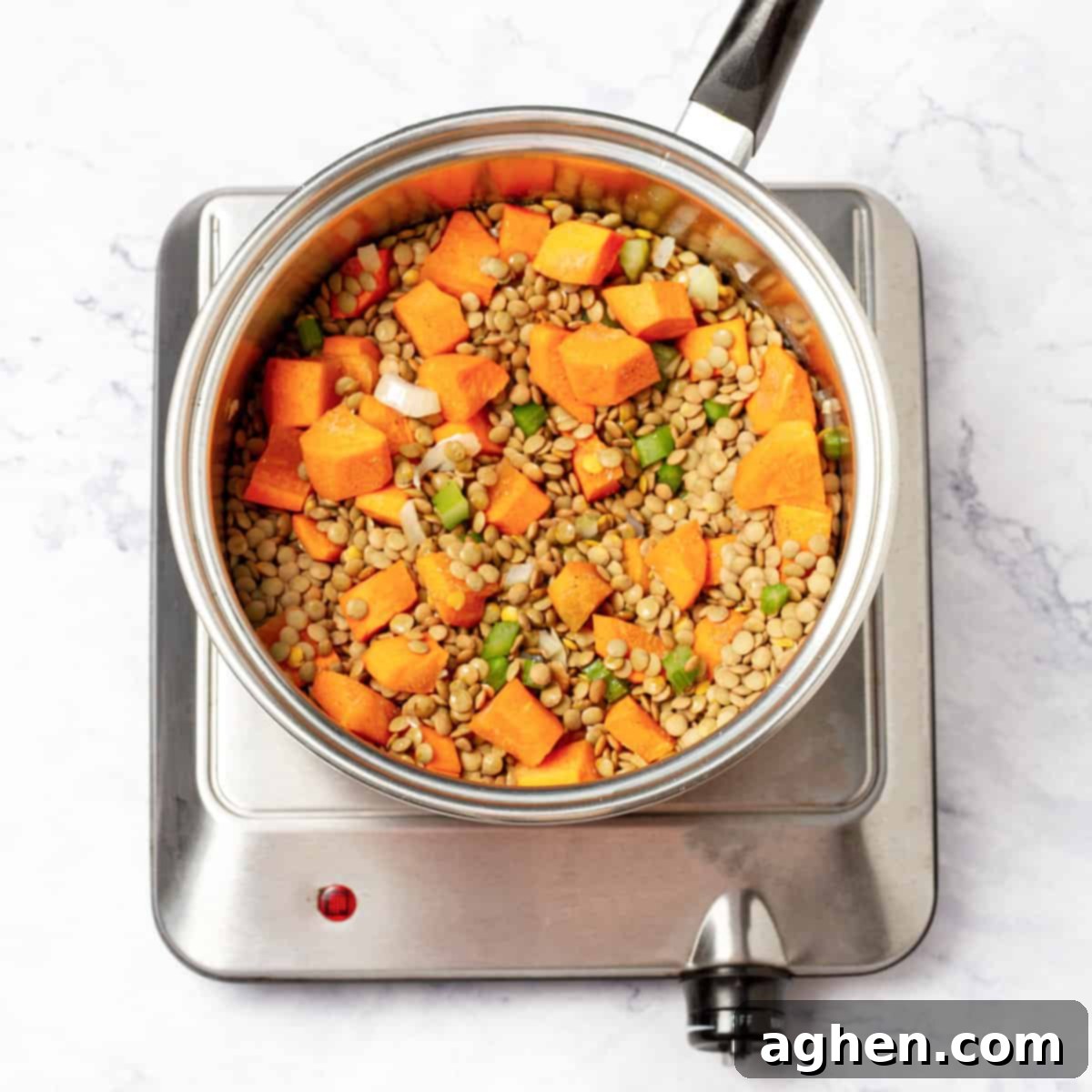 Your New Favorite Weight Watchers Lentil Soup 5 chopped onions, minced garlic, celery, and carrots in sauce pan