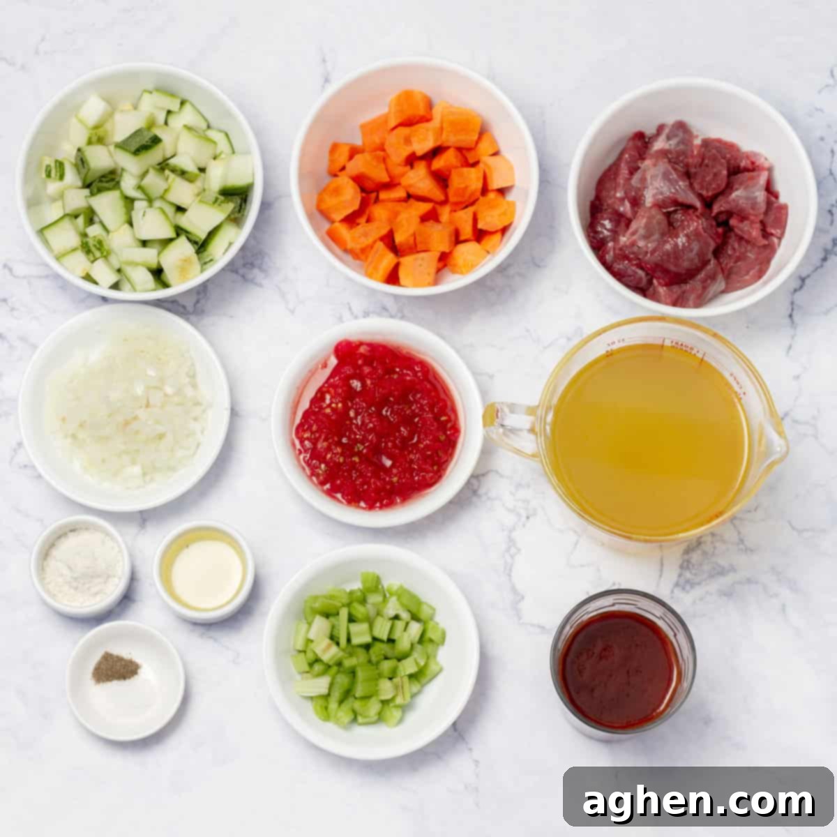 Various fresh ingredients for goulash including diced vegetables and beef