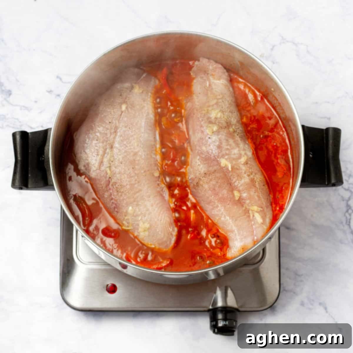 marinated hake filets into the Veracruzana sauce
